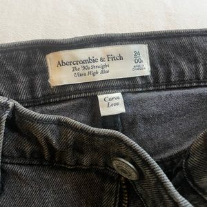 The 90s straight ultra high rise black jeans with slit on bottom. Never worn